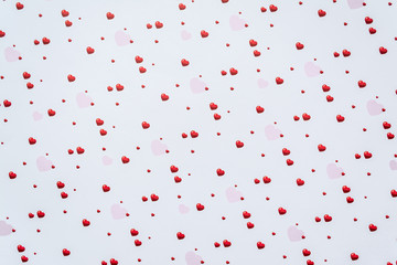 Abstract valentine's day background with red heart symbols on white background