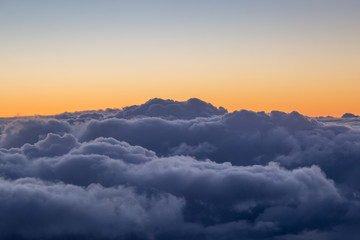 Storm Clouds at Sunset, Viewed from an Airplane Window