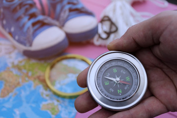 The concept of travel, a man determines the direction of the compass