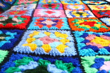 Multicolored handmade plaid of crochet made of granny squares