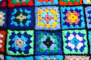 Multicolored handmade plaid of crochet made of granny squares