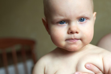 Portrait of a funny baby with blue eyes