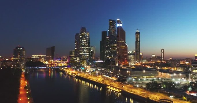 Night aerial view. Moscow City. View from above. City lights. Night panoramic shot on spring. Summer,4K