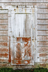 Vintage door built in 1850s at the old dairy ranch of  Pierce Point Ranch. Point Reyes National Seashore, Marin County, California, USA.