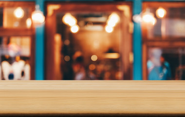 Selective Focus Empty wooden table in front of abstract blurred festive background with night market background bokeh for product montage display of product