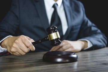 Counselor or Male lawyer working on courtroom sitting at the table. Legal law, Judge gavel with Justice lawyers advice with gavel and Scales of justice