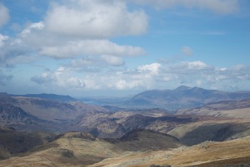 View from mountain in Lake District (Cumbria, UK): lakes and mountains, blue sky and clouds