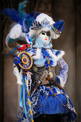 Fototapeta na wymiar Woman in Venetian carnival outfit. Marine theme. 