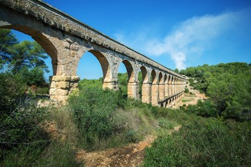 Fototapeta na wymiar Roman aqueduct 'El ponte del Diablo' (The Bridge of the Devil) near Tarragona, Catalonia, Spain