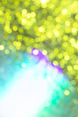 Golden glitter festive background with bokeh lights. Celebration concept for New Year, Christmas Holidays.