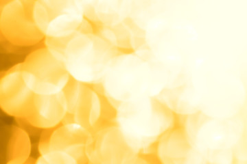 Golden glitter festive background with bokeh lights. Celebration concept for New Year, Christmas Holidays.