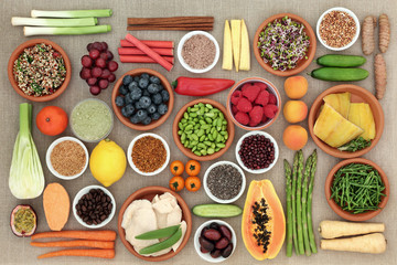 Healthy diet food concept including fish, meat, grains, seeds, coffee, supplement powders, fruit, vegetables & spices. High in antioxidants, protein, anthocyanins, vitamins & dietary fibre. Top view.