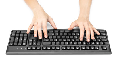 Woman's hands typing on black keyboard. Isolated on white.