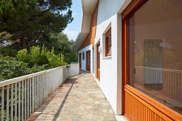 Long terrace in country house in a sunny summer day
