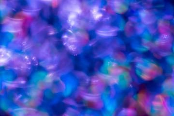 Rainbow blue glitter festive background with bokeh lights. Celebration concept for Holidays and anniversary.