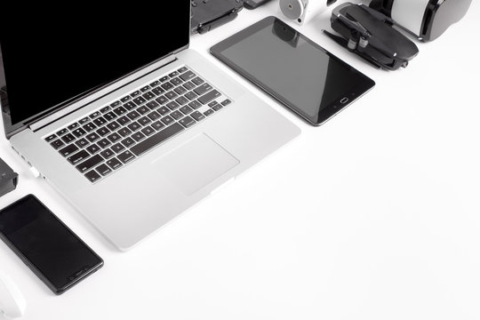 modern gadgets on a white background, laid out diagonally, the concept of devices in the workplace