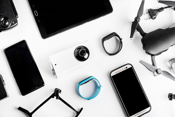 background of modern gadgets tablet next to the phone and the drone, concept devices used every day