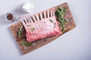 Raw rack of lamb with spices and herbs