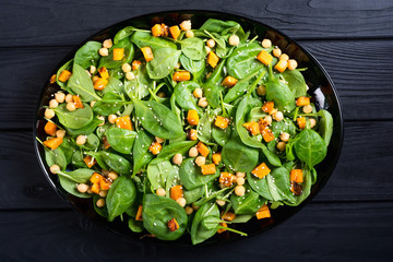 autumn salad with pumpkin , spinach , chickpea and sesame