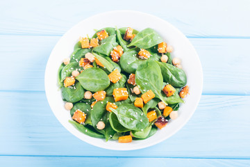 autumn salad with pumpkin , spinach , chickpea and sesame