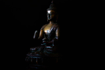 Fototapeta na wymiar Antique Buddha metal statue