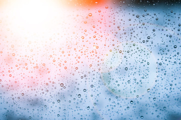 beautiful drops on the glass in the park background