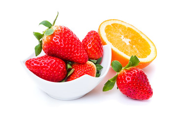 ripe strawberries in a plate orange on a white background