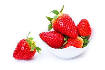 ripe strawberries in a white plate on a white background