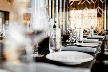 Empty glasses on the table and light table setting 