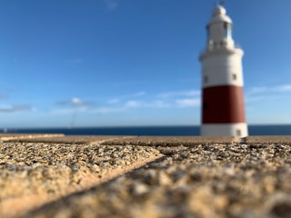 Fototapeta na wymiar lighthouse on coast of sea，empty,