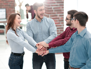 Group of people hands together partnership teamwork.