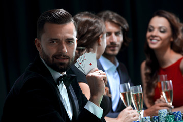 Handsome man playing in casino