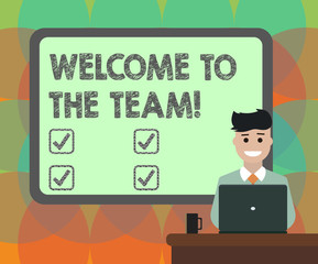Word writing text Welcome To The Team. Business concept for Greeting making part of a work group new showing Blank Bordered Board behind Man Sitting Smiling with Laptop Mug on Desk