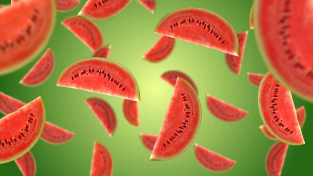 Watermelon slices falling down on green background. 4k video.