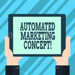 Text sign showing Automated Marketing Concept. Conceptual photo automate repetitive tasks such as emails Hu analysis Hand Holding Blank Screen Tablet Smartphone Display Unit photo