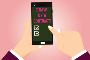 Text sign showing Draw Up A Contract. Conceptual photo Write a business agreement cooperation legal papers Hu analysis Hands Holding Pointing Touching Smartphone Blank Color Screen
