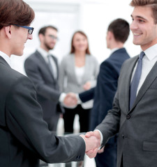 handshake of business partners after the briefing