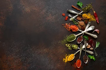 Foto op Plexiglas Assortment of natural spices on a vintage spoons.Top view with copy space. © lilechka75