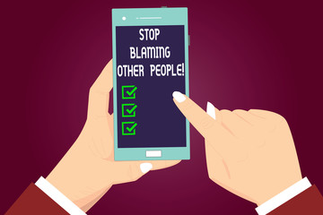 Writing note showing Stop Blaming Other People. Business photo showcasing Do not make excuses assume your faults guilt Hu analysis Hands Holding Pointing Smartphone Blank Color Screen