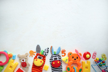 Children's toys and accessories on a white background. View from above