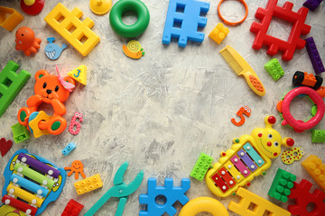 Children's toys and accessories on a white background. View from above © dyageleva