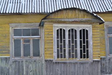 Abandoned russian traditional wooden house, shabby interior. Abandoned rustic house. Russian winter. Traditional russian window jamb. Old grunge home