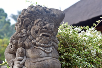 Hindu stone statue at Pura Tirta Empul Temple, Bali Island, Indonesia