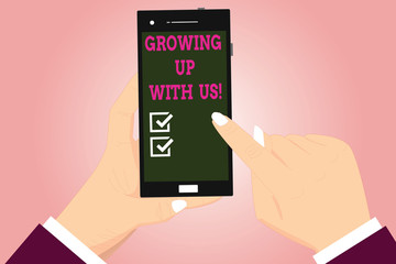 Text sign showing Growing Up With Us. Conceptual photo Offering help assistance to make your business grow Hu analysis Hands Holding Pointing Touching Smartphone Blank Color Screen