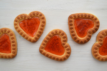 Red biscuit on white background. Gingerbread couple. Heart symbol. Love postcard.