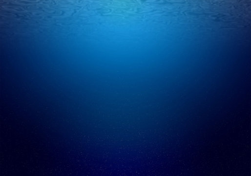 Natural underwater background of deep ocean with sunlight