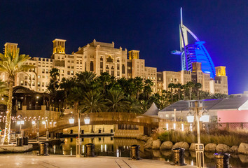 Fototapeta na wymiar Night view of Burj Al Arab (Tower of the Arabs) seen from Madinat Jumeirah in Dubai, United Arab Emirates