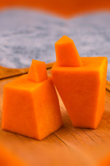 Figures from pieces of pumpkin. The image of a man and a woman. The symbol of mutual love. Vertical.