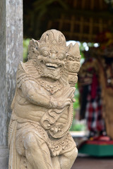 Fototapeta premium Hindu stone statue at Taman Ayun Temple in Ubud, Bali Island, Indonesia