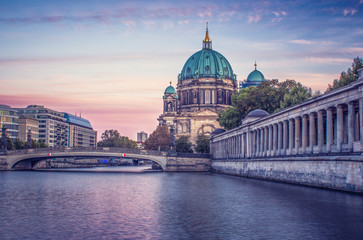 Looking across the river at the Berlin Cathedral during a colorful sunset 